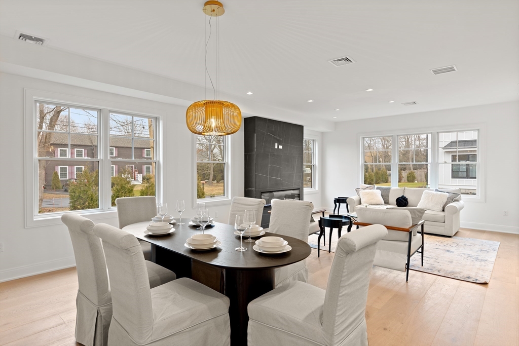 8 Orchard Road, Unit A Gloucester, MA 01930 - Photo 3 of 6 a view of a dining room with furniture and a large window