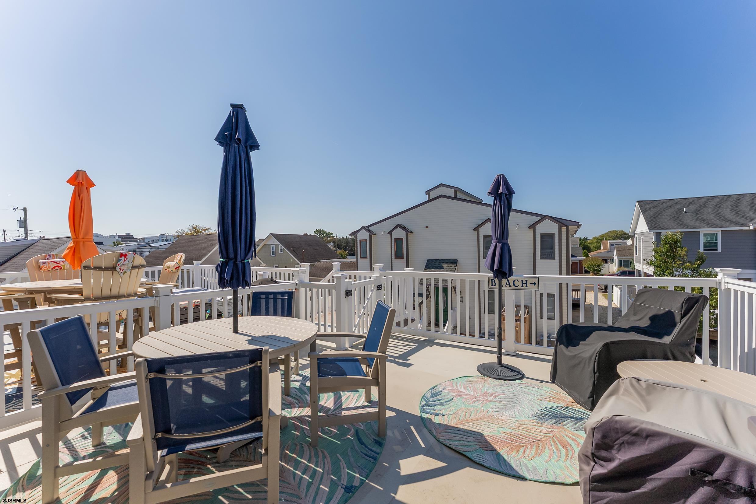206 East Cardinal Road, Unit 4 Wildwood Crest, NJ 08260 - Photo 11 of 32 a view of a dining room with furniture window and rug