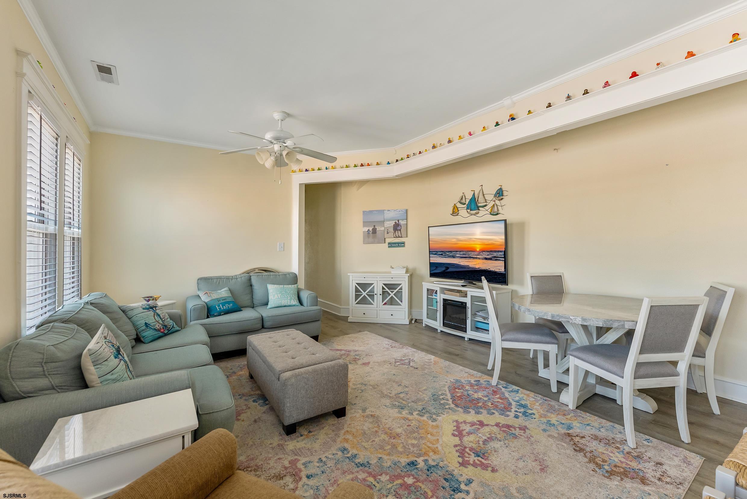 206 East Cardinal Road, Unit 4 Wildwood Crest, NJ 08260 - Photo 15 of 32 a living room with furniture and a flat screen tv