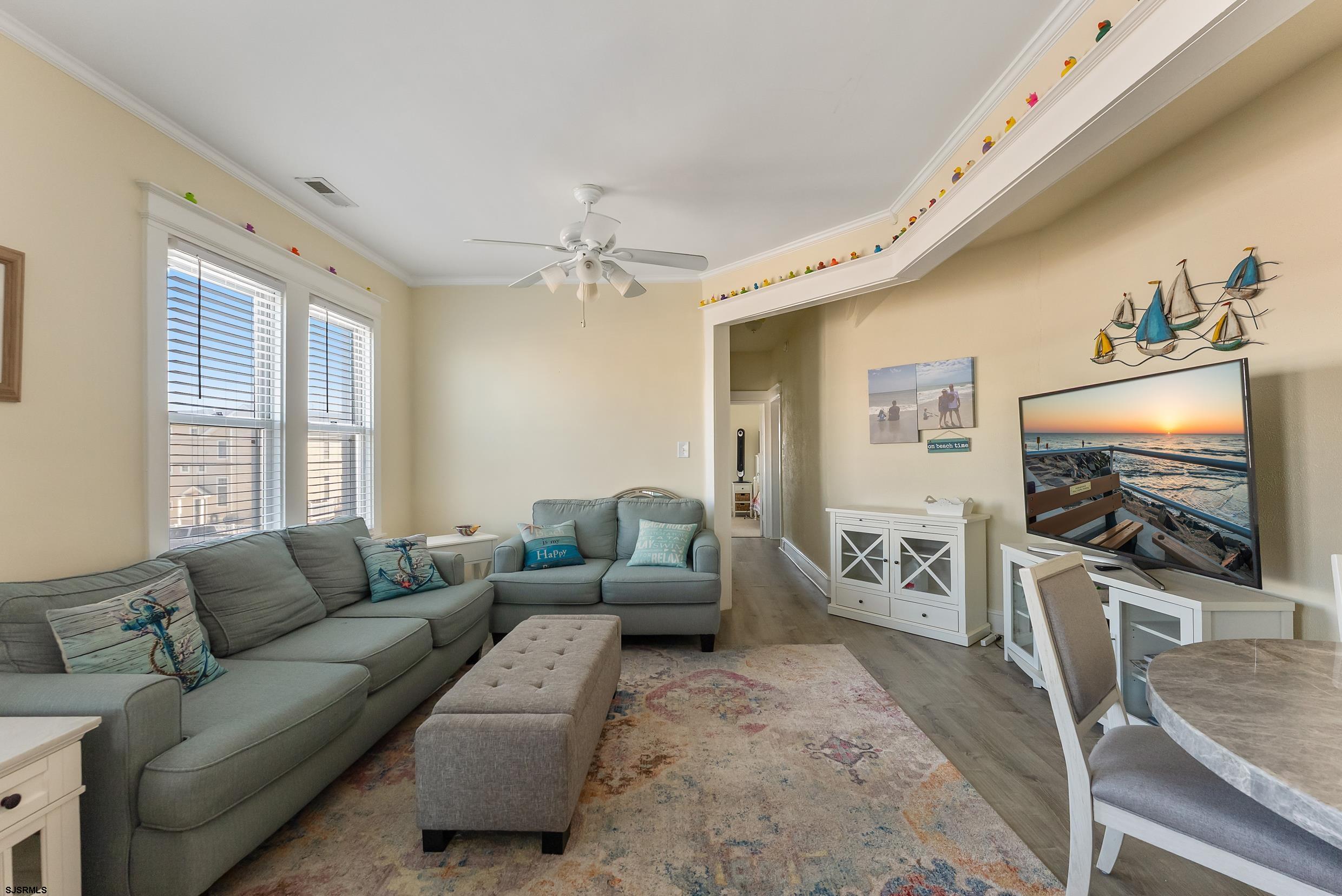 206 East Cardinal Road, Unit 4 Wildwood Crest, NJ 08260 - Photo 16 of 32 a living room with furniture and a flat screen tv