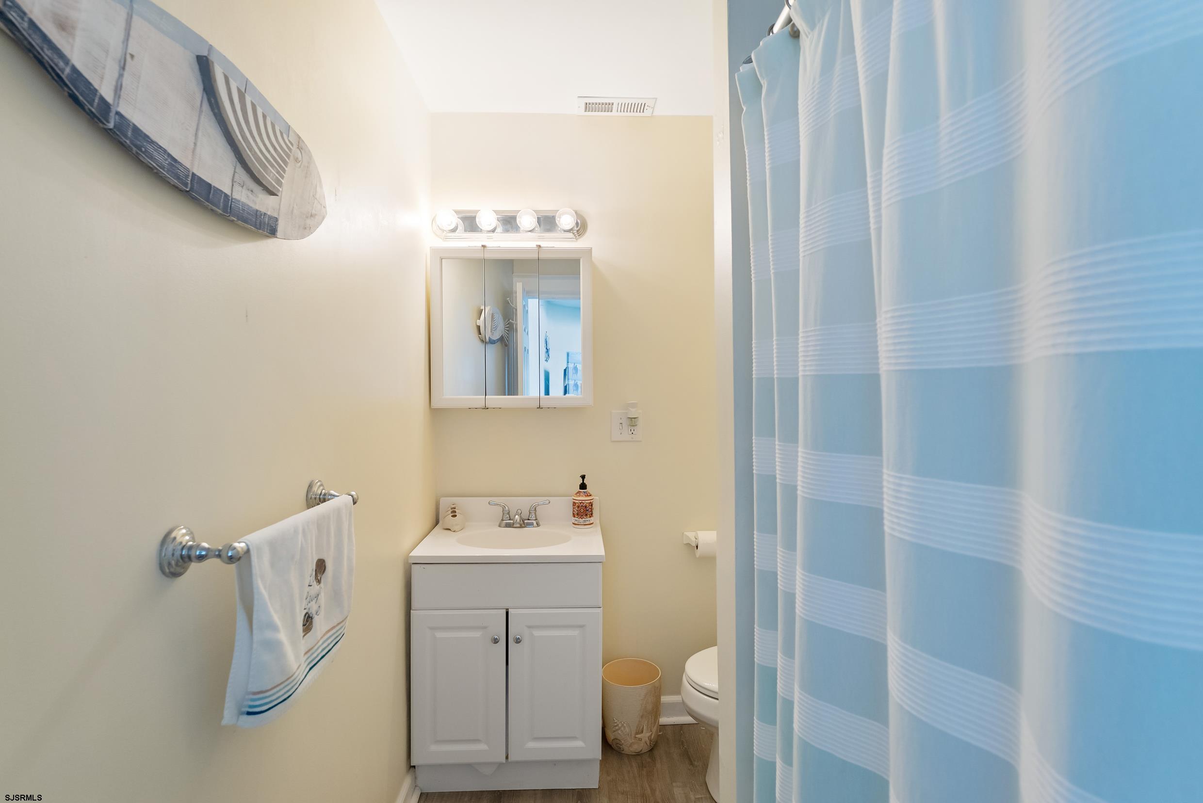 206 East Cardinal Road, Unit 4 Wildwood Crest, NJ 08260 - Photo 17 of 32 a bathroom with a sink toilet and shower