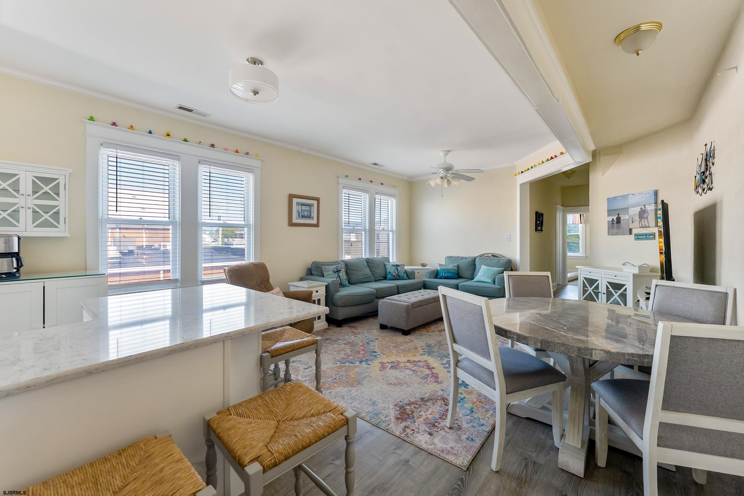 206 East Cardinal Road, Unit 4 Wildwood Crest, NJ 08260 - Photo 19 of 32 a living room with furniture and a large window