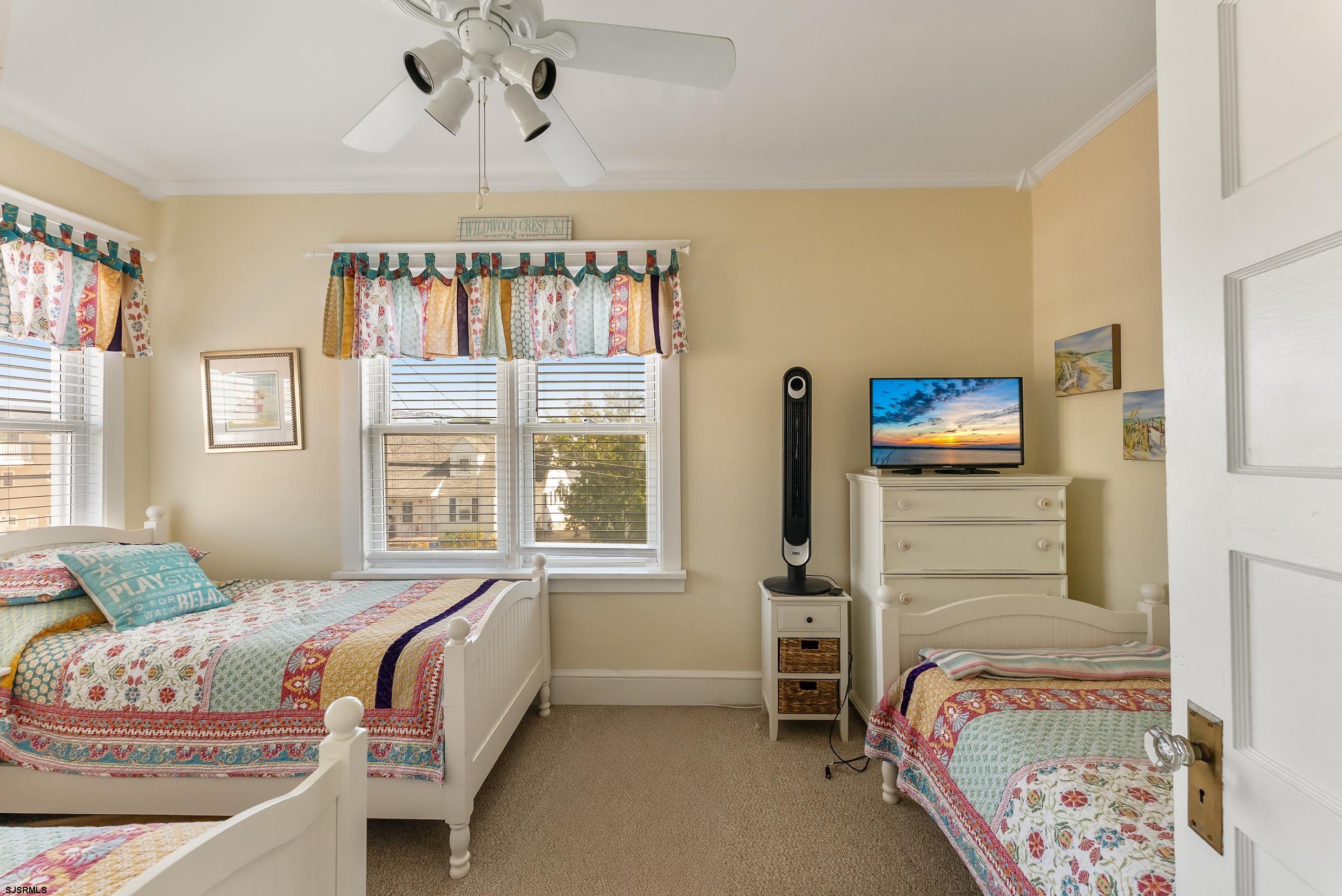 206 East Cardinal Road, Unit 4 Wildwood Crest, NJ 08260 - Photo 20 of 32 a bedroom with a bed and a window