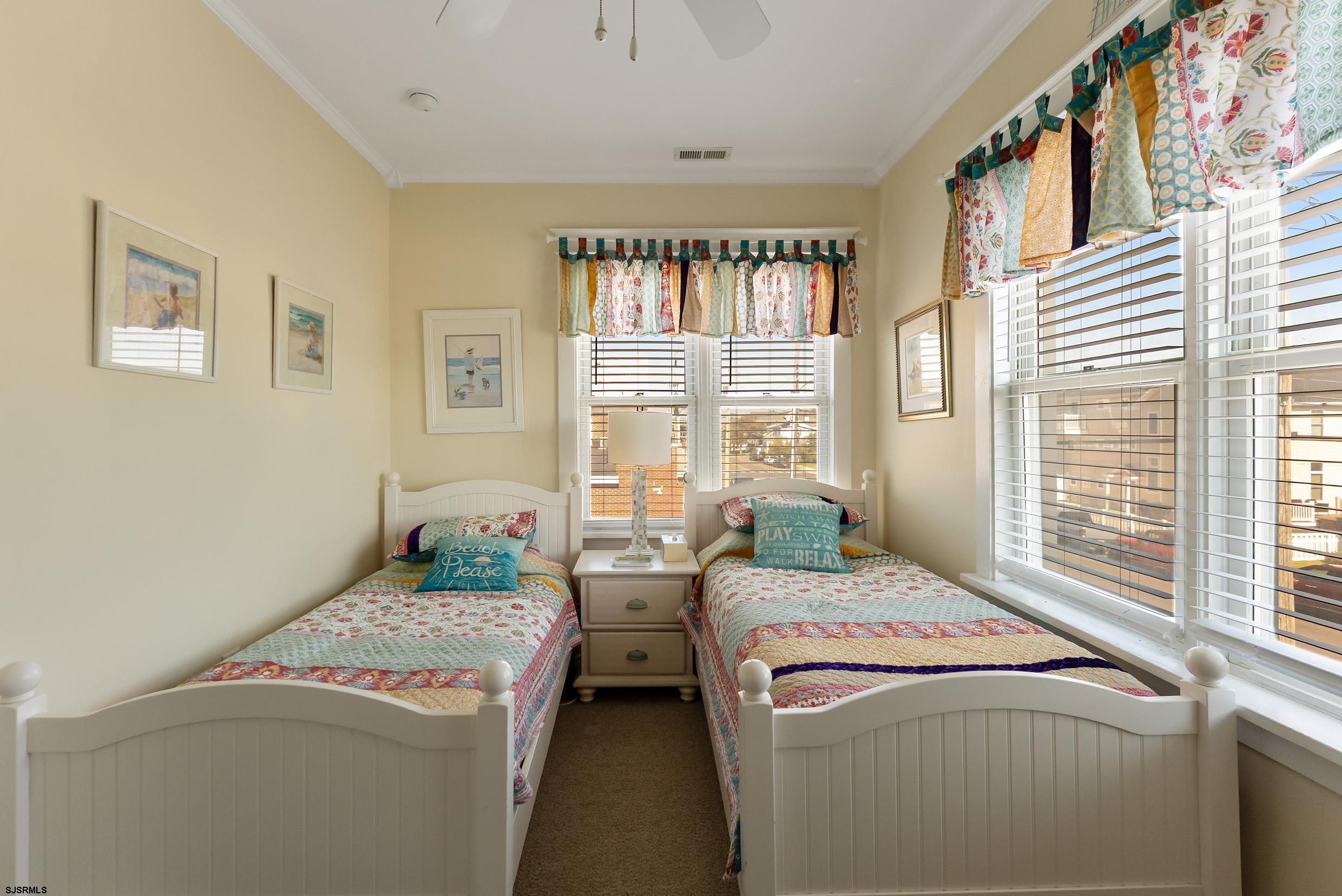 206 East Cardinal Road, Unit 4 Wildwood Crest, NJ 08260 - Photo 21 of 32 a bedroom with a bed and a window