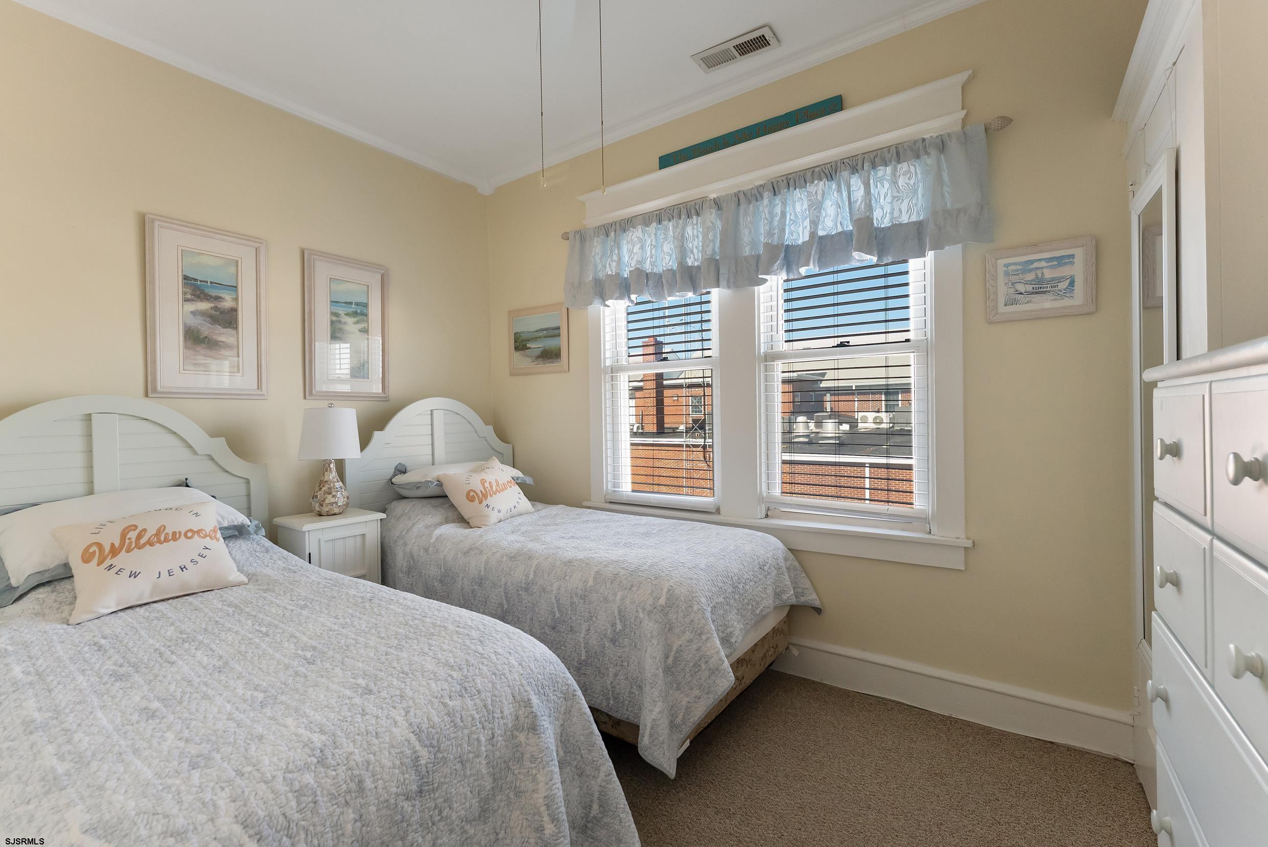 206 East Cardinal Road, Unit 4 Wildwood Crest, NJ 08260 - Photo 22 of 32 a bedroom with two beds and a window