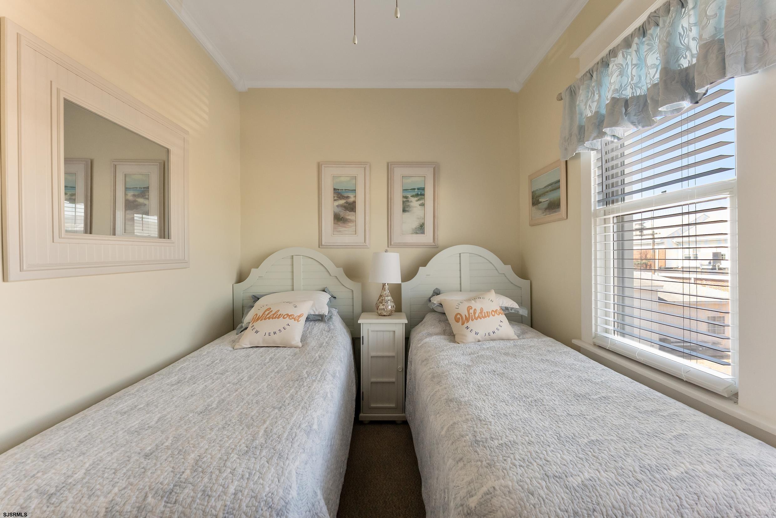 206 East Cardinal Road, Unit 4 Wildwood Crest, NJ 08260 - Photo 23 of 32 a bedroom with two bed and a window