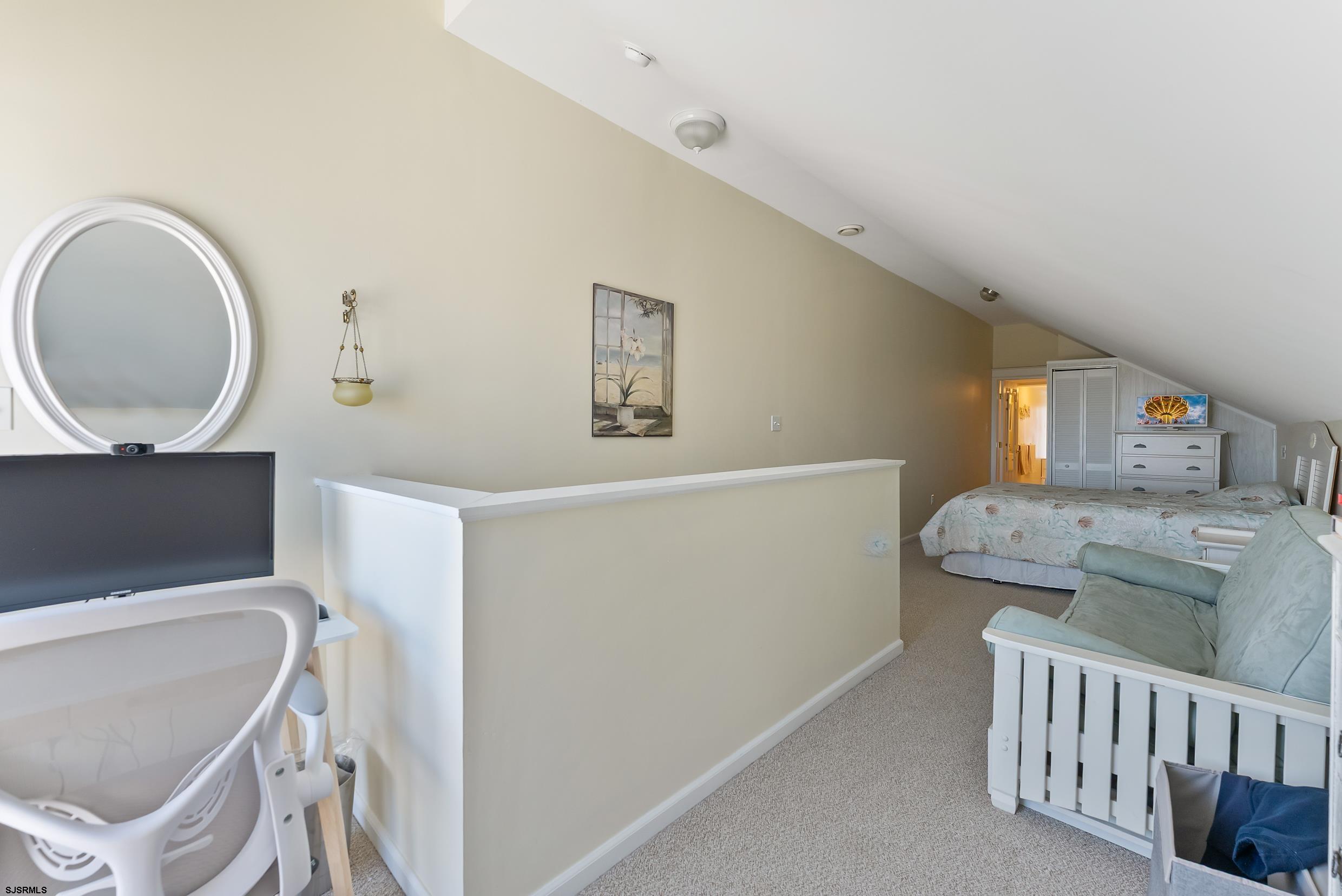 206 East Cardinal Road, Unit 4 Wildwood Crest, NJ 08260 - Photo 30 of 32 a living room with furniture and a window