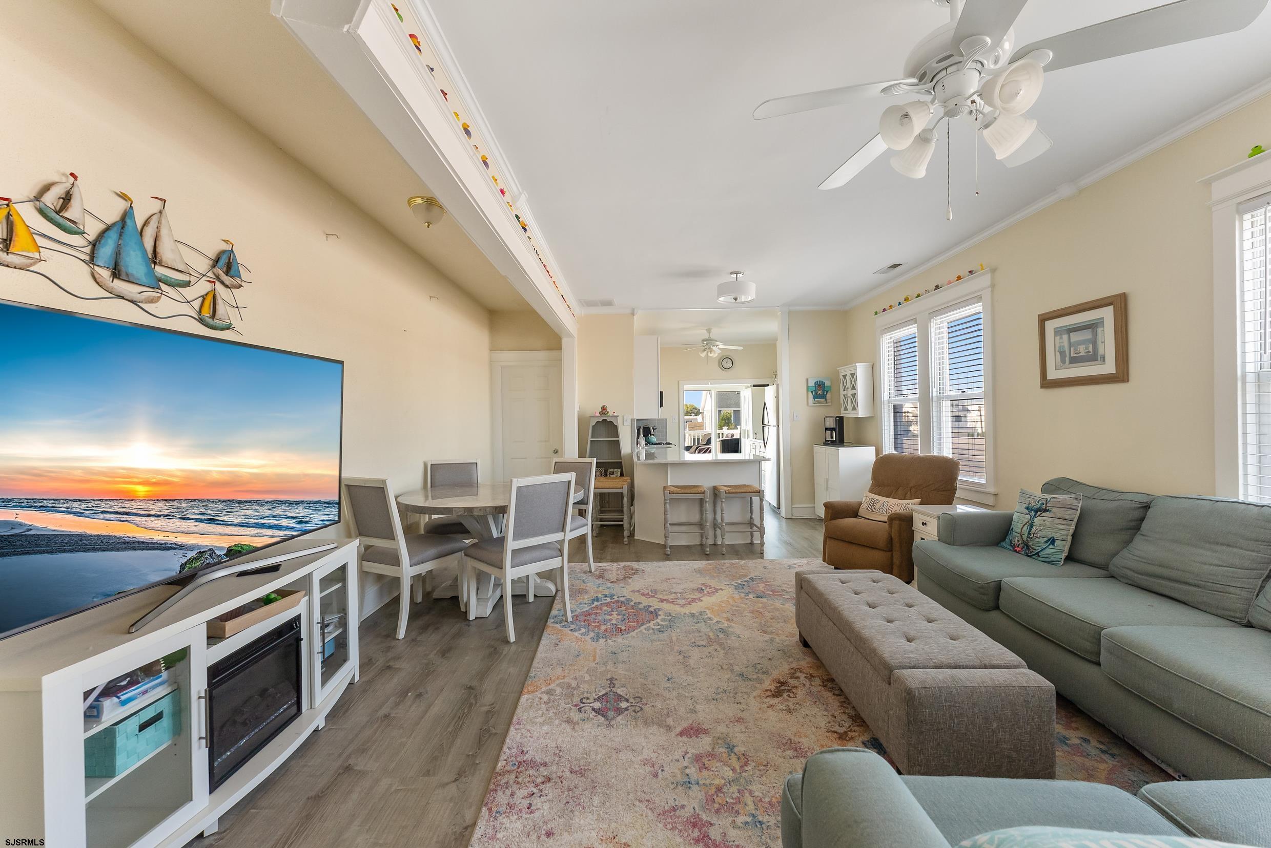 206 East Cardinal Road, Unit 4 Wildwood Crest, NJ 08260 - Photo 5 of 32 a living room with furniture and a flat screen tv