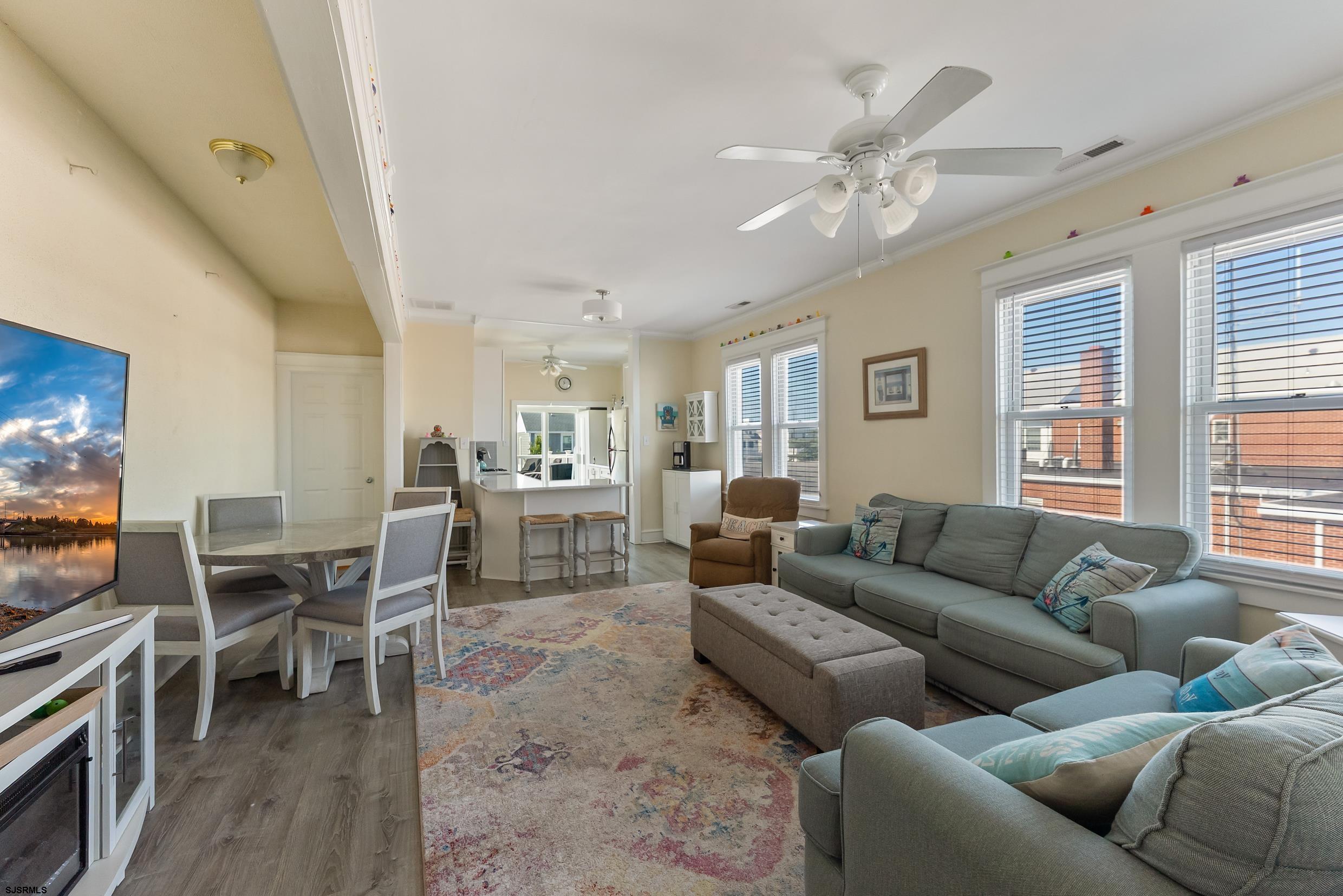 206 East Cardinal Road, Unit 4 Wildwood Crest, NJ 08260 - Photo 6 of 32 a living room with furniture kitchen view and a large window