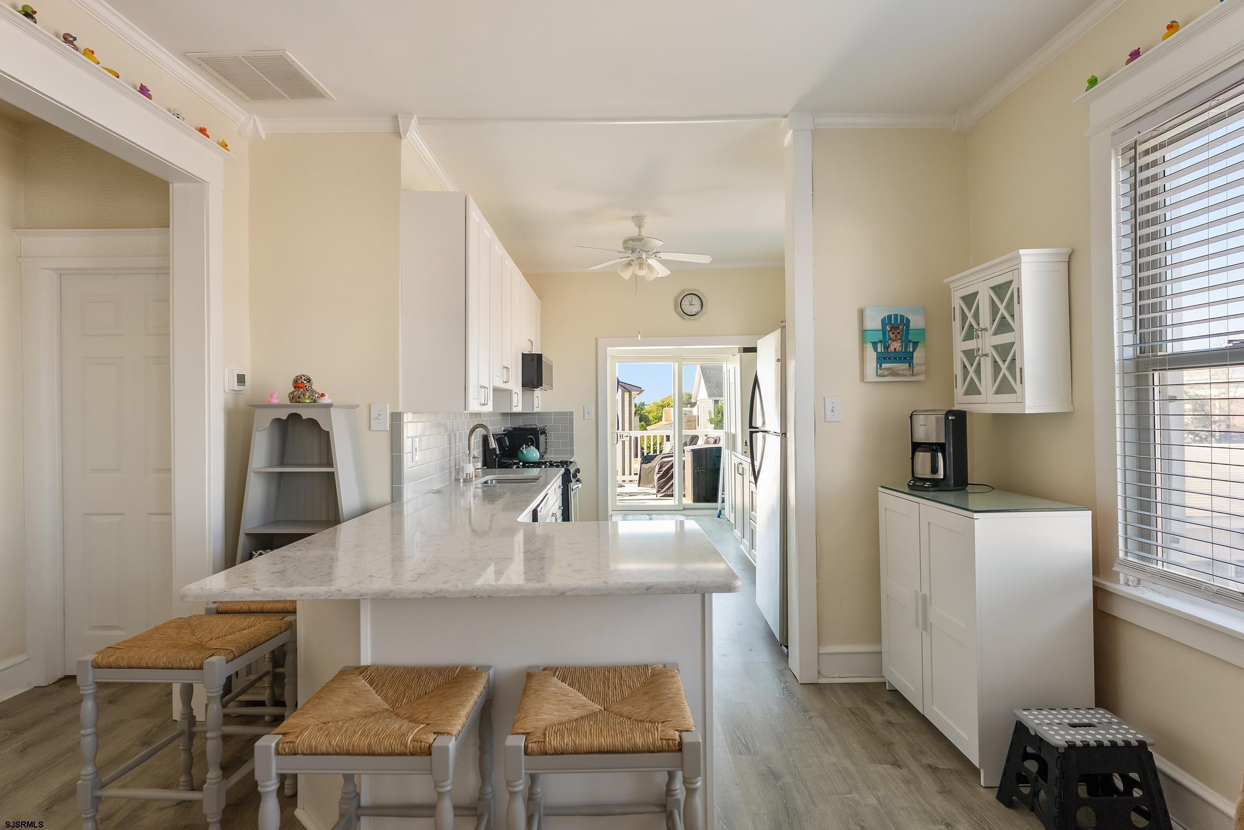 206 East Cardinal Road, Unit 4 Wildwood Crest, NJ 08260 - Photo 7 of 32 a dining room with furniture and window
