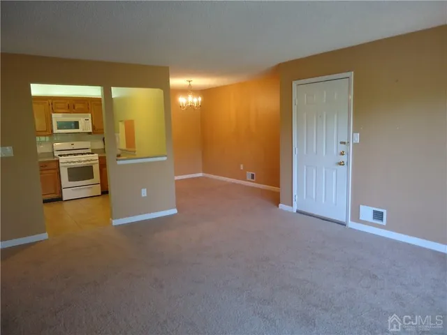 a view of a kitchen with a sink