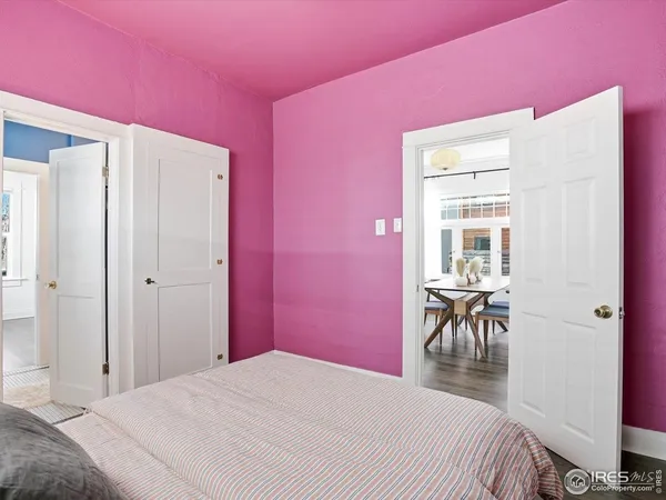 a bedroom with a bed and a table