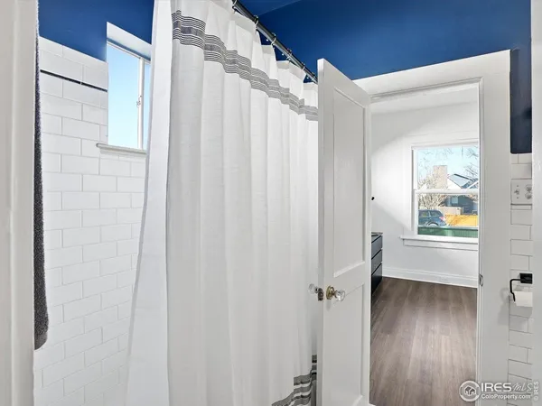 a view of a bathroom with a shower curtain