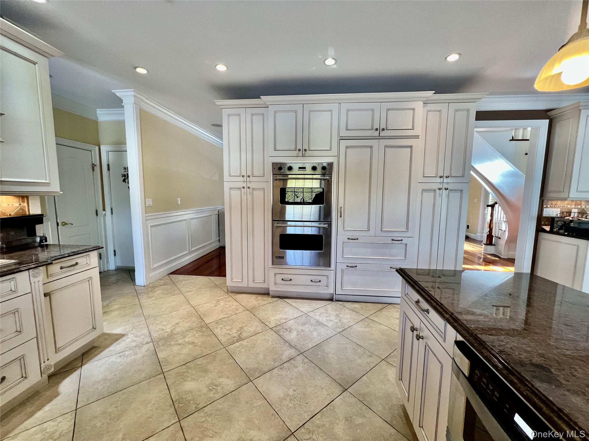 3683 Orchard Road Wantagh, NY 11793 - Photo 13 of 42 a kitchen with stainless steel appliances granite countertop a refrigerator and a stove