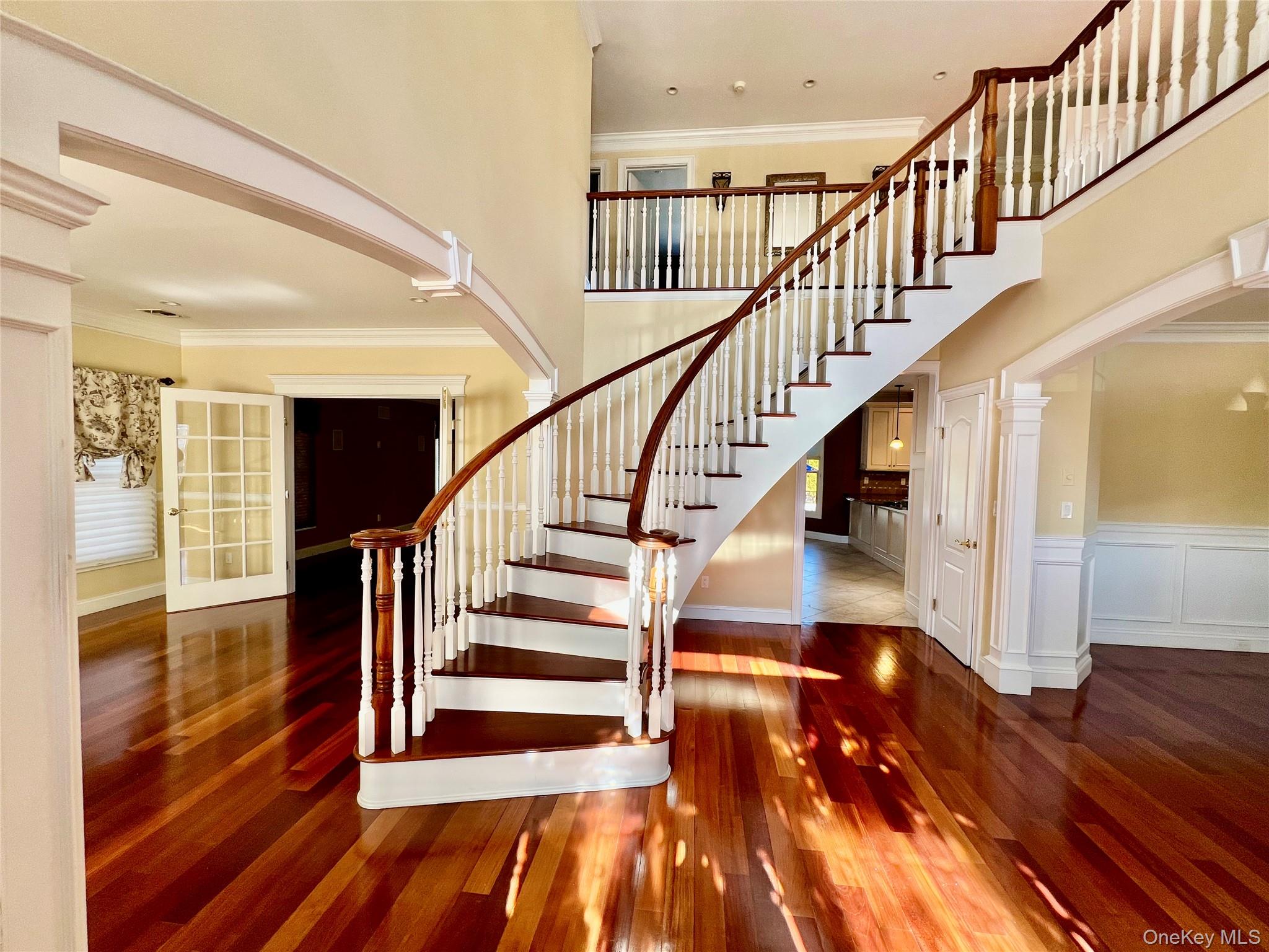 3683 Orchard Road Wantagh, NY 11793 - Photo 16 of 42 a view of staircase with wooden floor and a rug