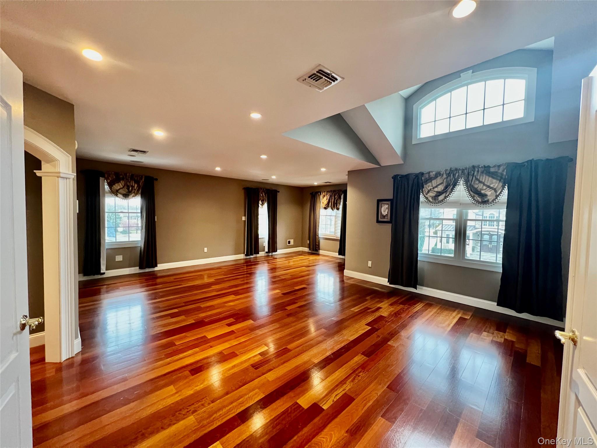 3683 Orchard Road Wantagh, NY 11793 - Photo 17 of 42 a view of an empty room with wooden floor and a window