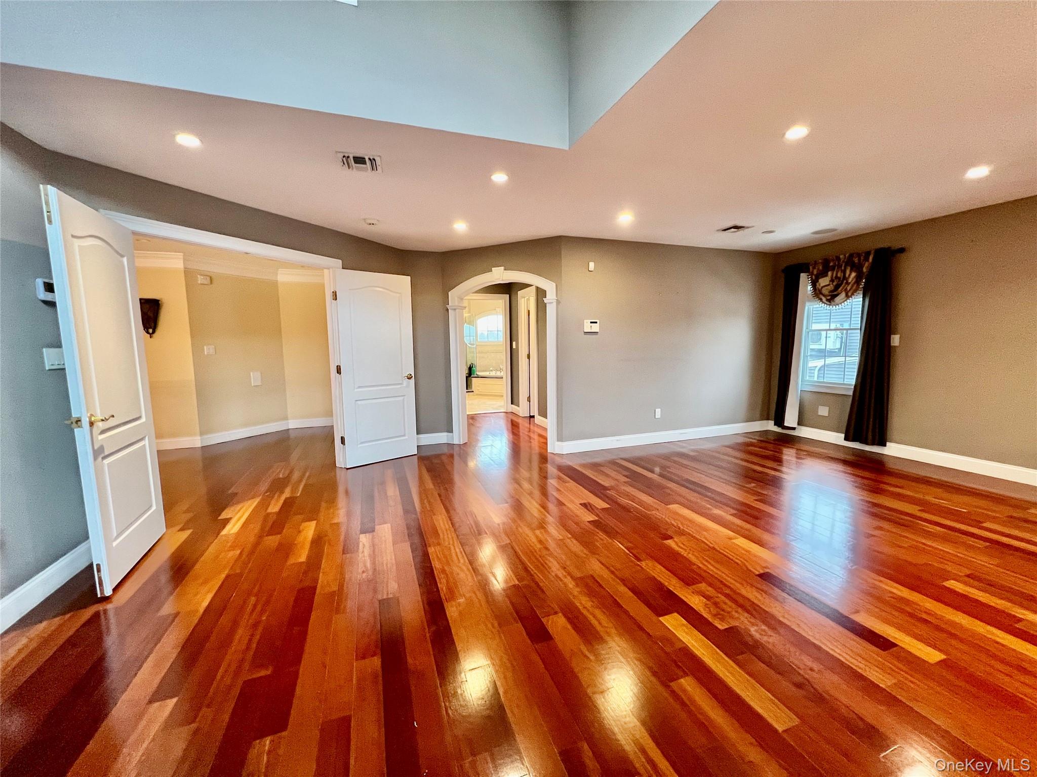 3683 Orchard Road Wantagh, NY 11793 - Photo 19 of 42 a view of an empty room with wooden floor and a window
