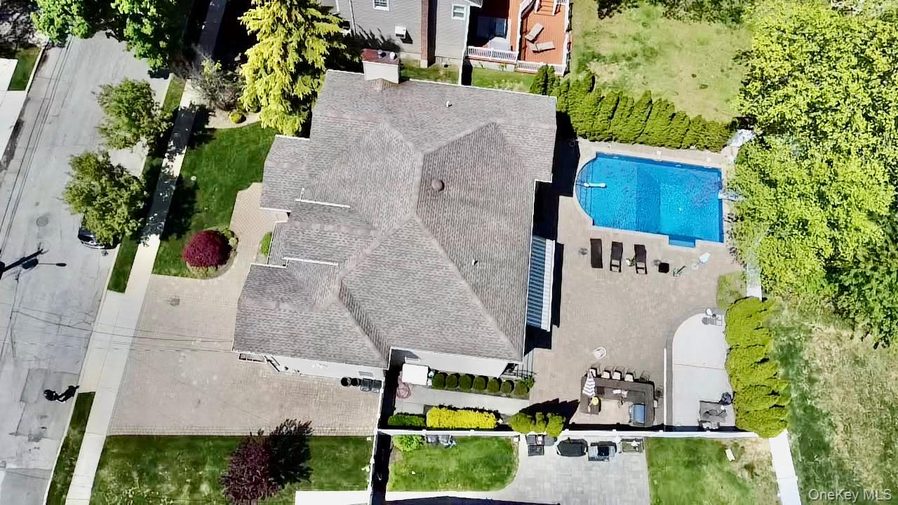 3683 Orchard Road Wantagh, NY 11793 - Photo 35 of 42 an aerial view of residential house with outdoor space and swimming pool