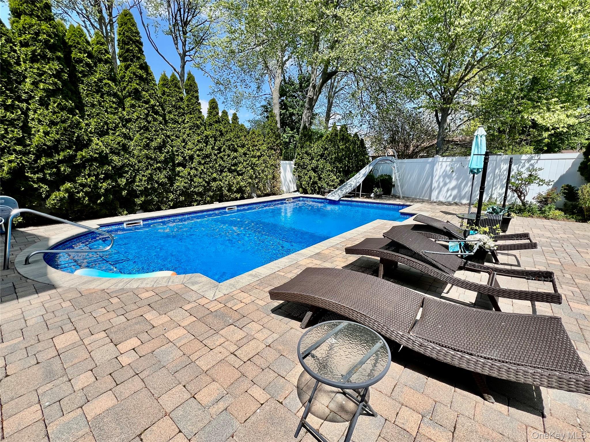 3683 Orchard Road Wantagh, NY 11793 - Photo 37 of 42 a view of a patio with chairs and potted plants