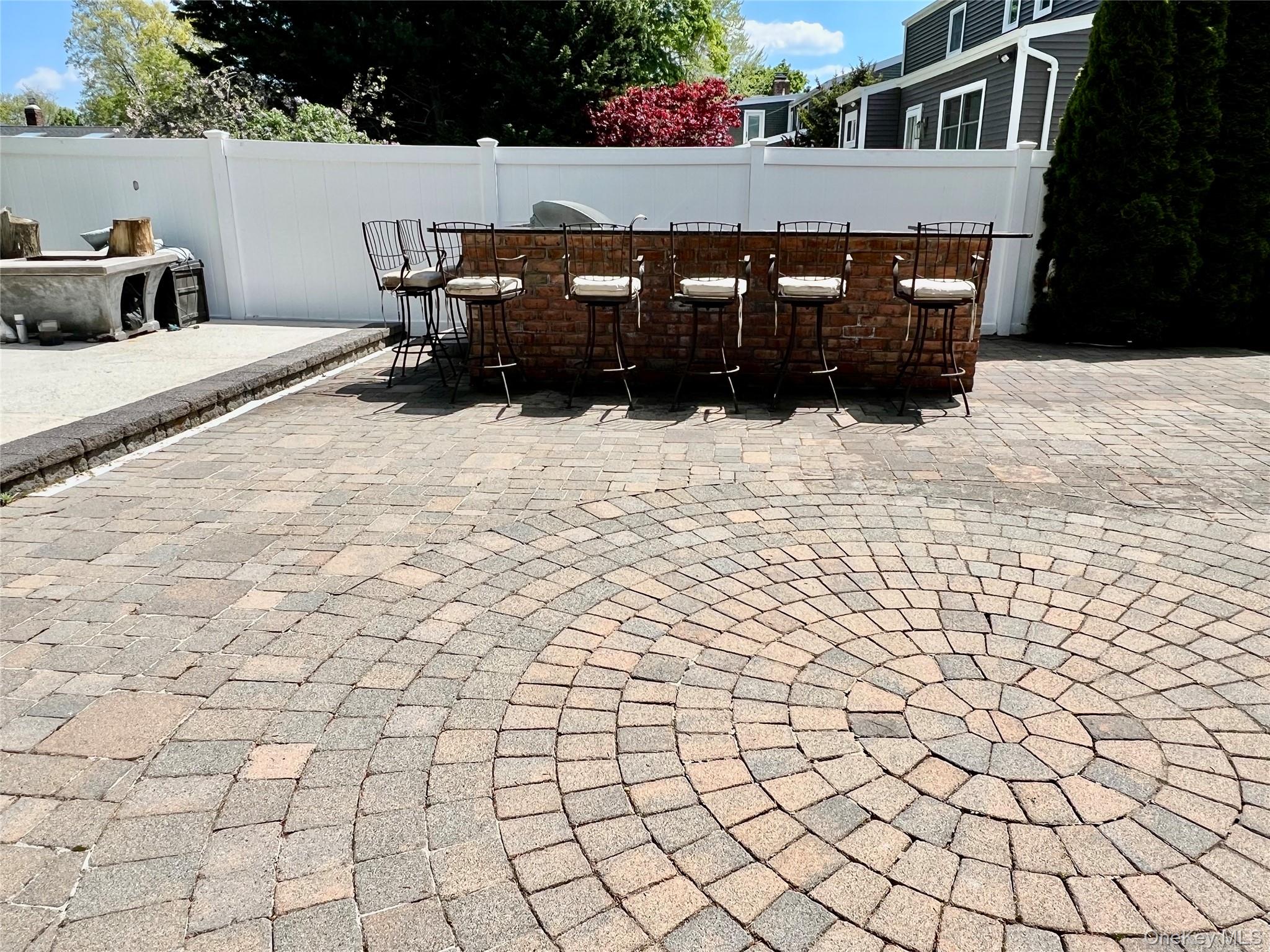 3683 Orchard Road Wantagh, NY 11793 - Photo 38 of 42 a terrace of a house with outdoor seating