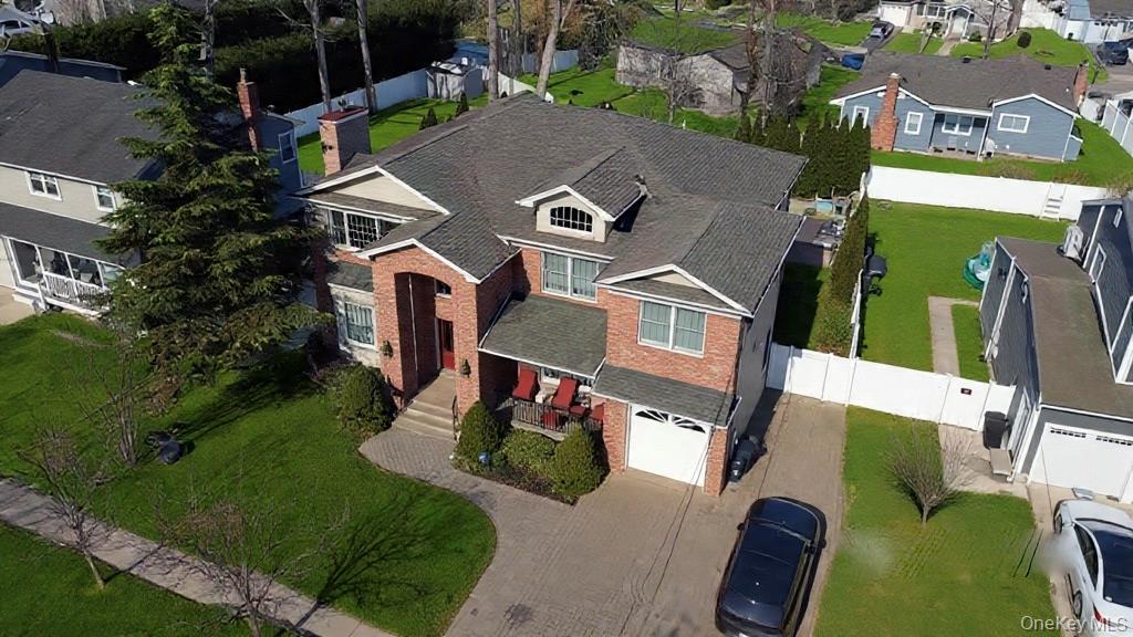 3683 Orchard Road Wantagh, NY 11793 - Photo 4 of 42 an aerial view of residential houses with outdoor space and parking