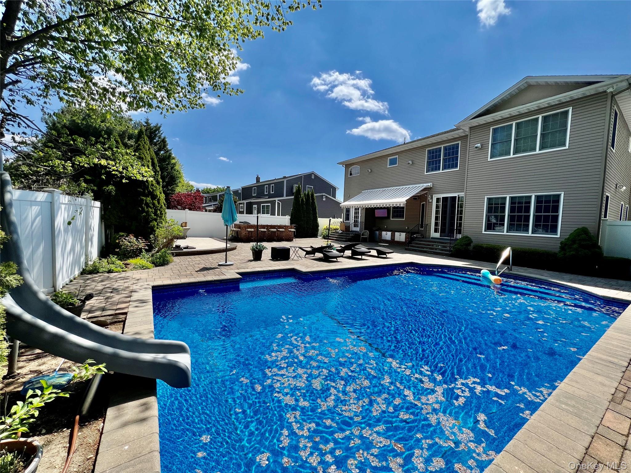 3683 Orchard Road Wantagh, NY 11793 - Photo 42 of 42 a living room with furniture a pool table and chairs
