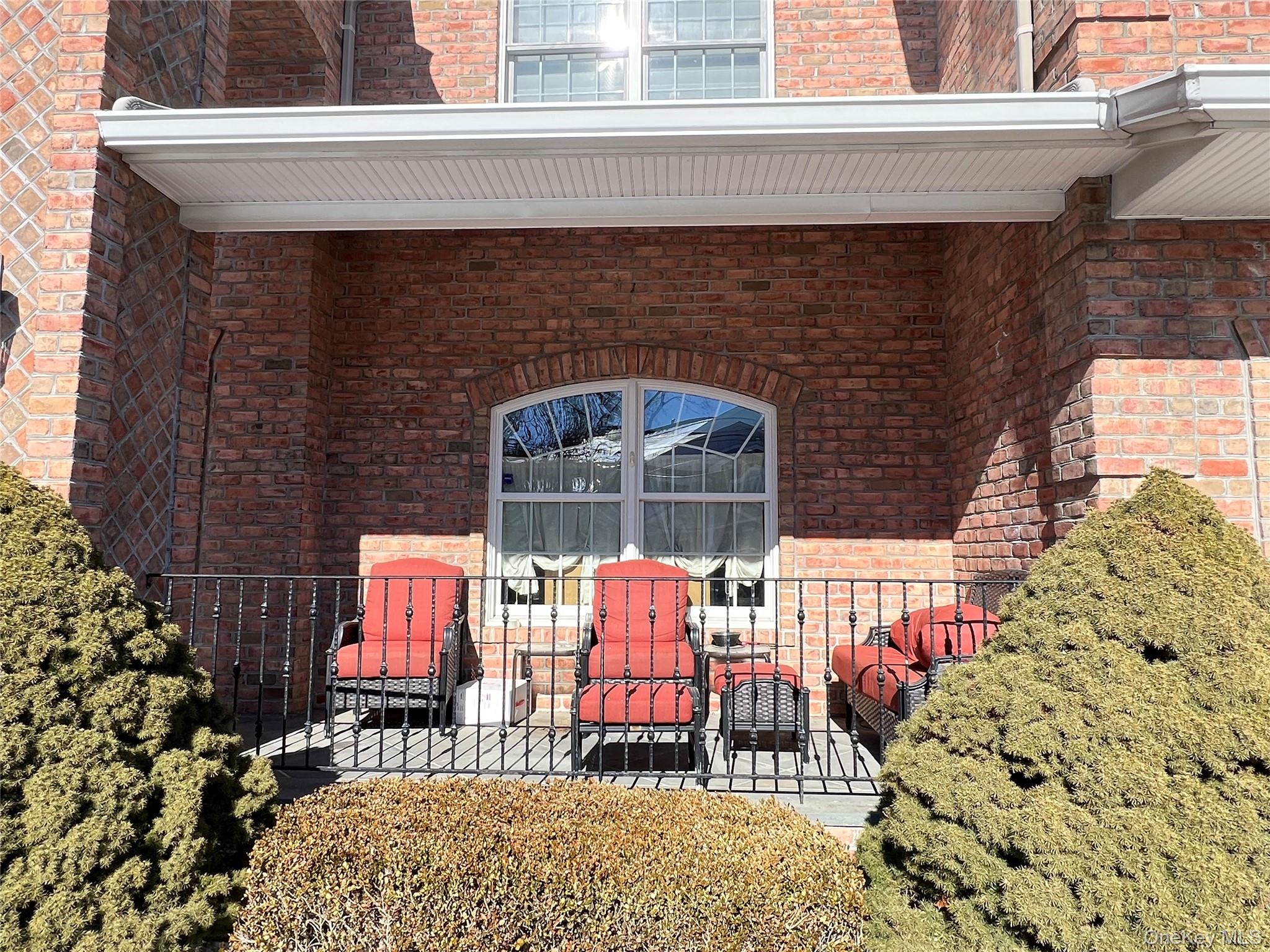 3683 Orchard Road Wantagh, NY 11793 - Photo 5 of 42 a building outdoor space with patio furniture and potted plants