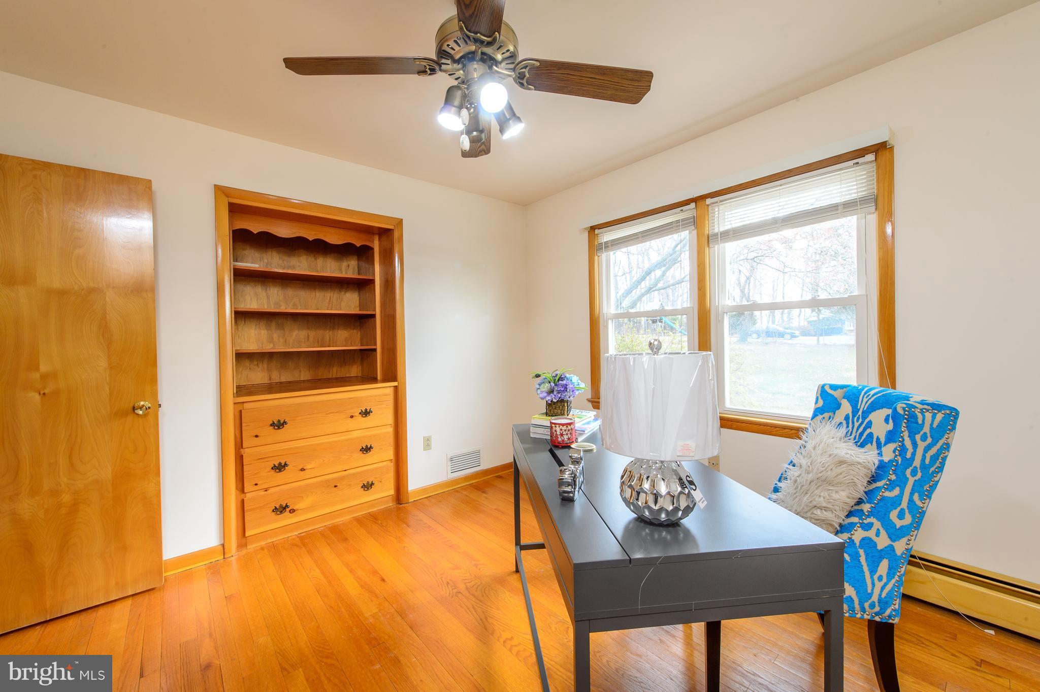 25229 Woodfield Road Damascus, MD 20872 - Photo 22 of 30 a view of a dining room with furniture window and wooden floor