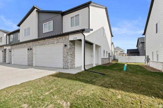 1262 West 500 South Logan, UT 84321 - Photo 37 of 39 Contemporary townhome exterior featuring light siding and stacked stone accents
