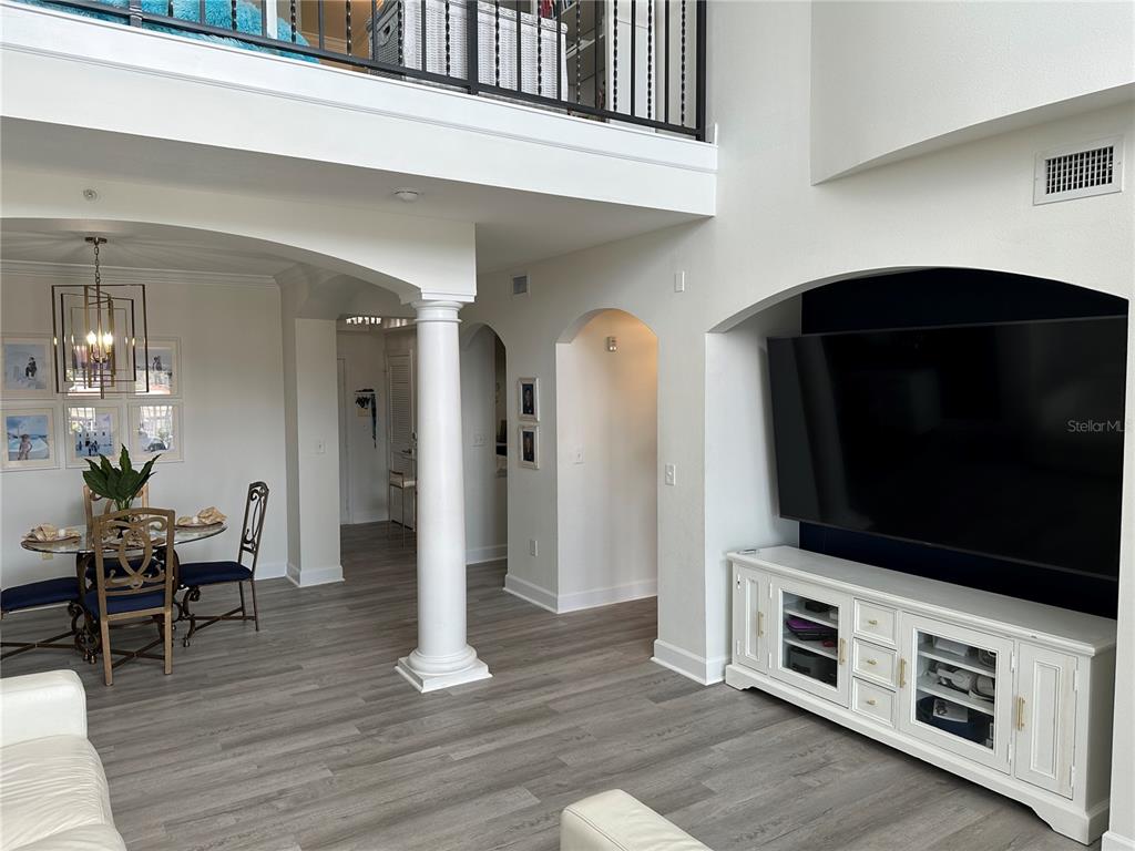 808 3rd Avenue West, Unit 701 Bradenton, FL 34205 - Photo 11 of 45 a living room with furniture and a flat screen tv