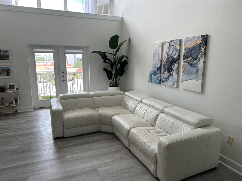 808 3rd Avenue West, Unit 701 Bradenton, FL 34205 - Photo 8 of 45 a living room with furniture and a large window