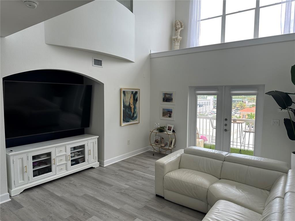 808 3rd Avenue West, Unit 701 Bradenton, FL 34205 - Photo 9 of 45 a living room with furniture and a flat screen tv