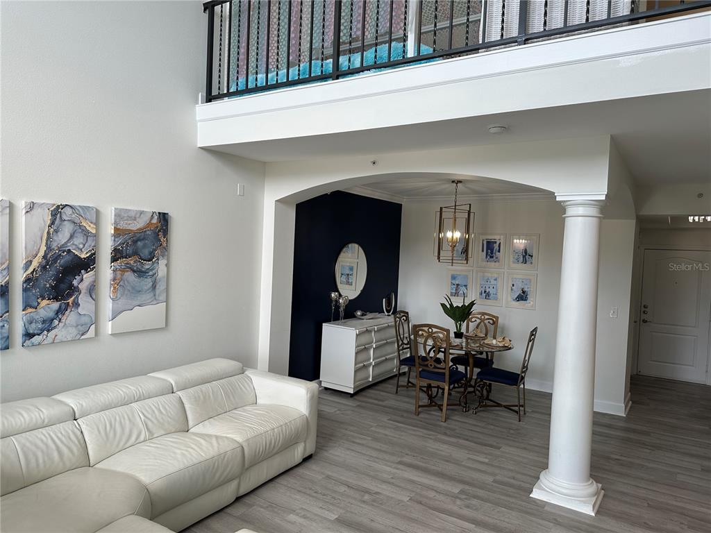 808 3rd Avenue West, Unit 701 Bradenton, FL 34205 - Photo 10 of 45 a living room with furniture and a wooden floor