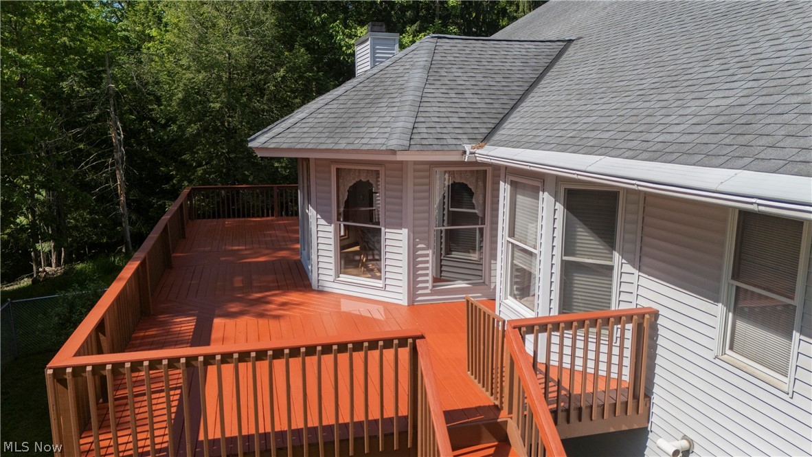 8745 Broadview Road Broadview Heights, OH 44147 - Photo 33 of 49 Expansive outdoor deck with a vibrant red-stained finish and matching wood railings
