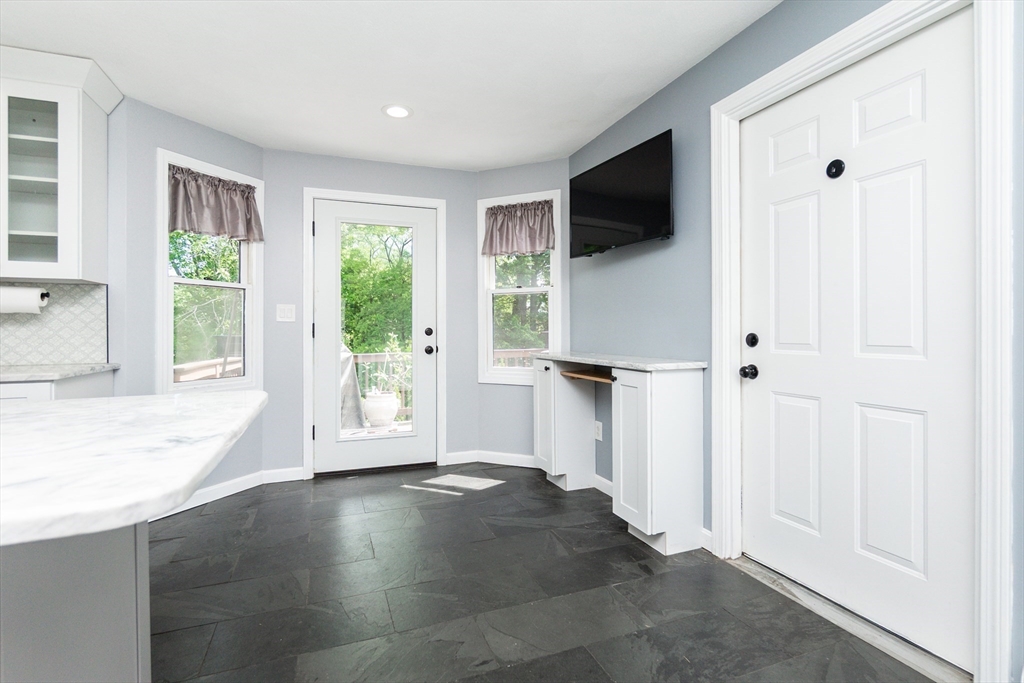 63 Bow Street Saugus, MA 01906 - Photo 11 of 42 a view of a livingroom with wooden floor and a flat screen tv