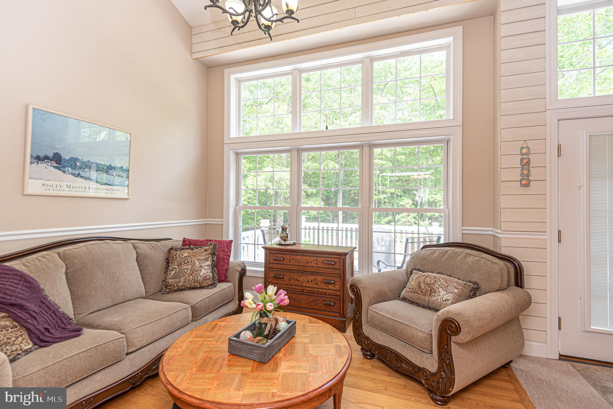 9331 Croppers Island Road Newark, MD 21841 - Photo 17 of 71 a living room with furniture and a large window