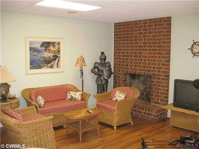 2841 West Brigstock Road Midlothian, VA 23113 - Photo 11 of 11 a living room with furniture and a fireplace