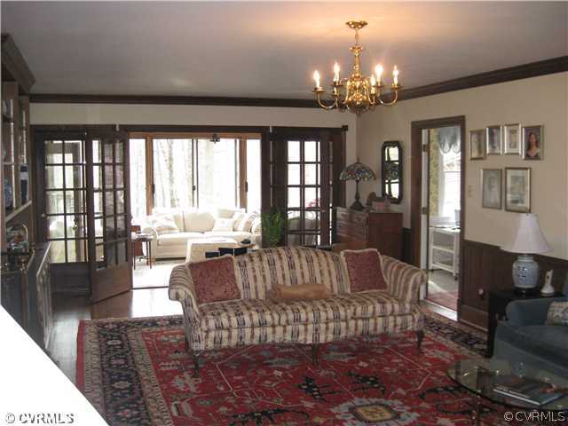 2841 West Brigstock Road Midlothian, VA 23113 - Photo 3 of 11 a living room with patio furniture and a chandelier
