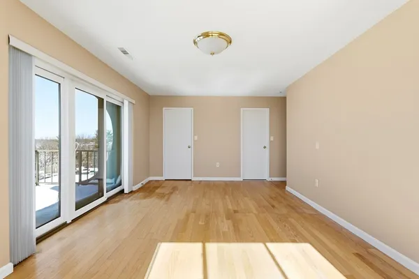 a view of an empty room and window
