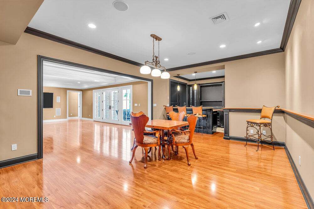 2645 River Road Manasquan, NJ 08736 - Photo 134 of 169 a view of a dining room with furniture window and wooden floor