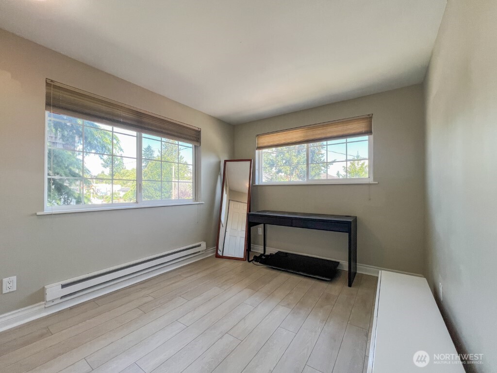 633 Northwest 85th Street, Unit 301 Seattle, WA 98117 - Photo 19 of 34 wooden floor and window in a room