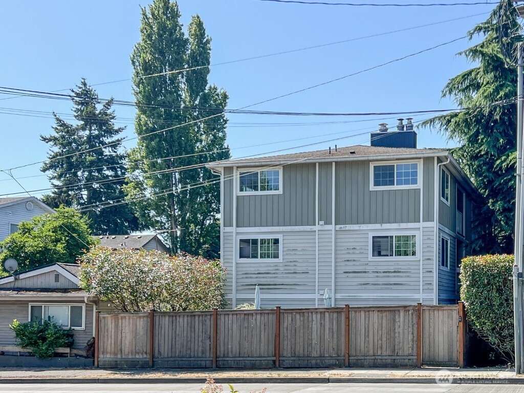 633 Northwest 85th Street, Unit 301 Seattle, WA 98117 - Photo 34 of 34 a front view of a house with a yard