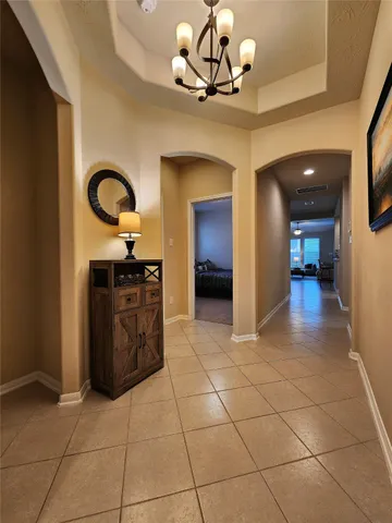 a view of a kitchen with a sink and cabinets