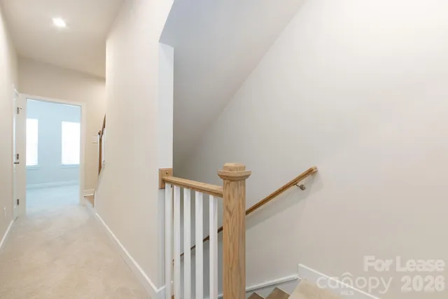 a view of a hallway with a white walls
