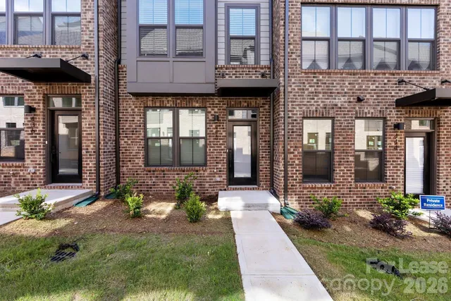 a view of a brick building with many windows