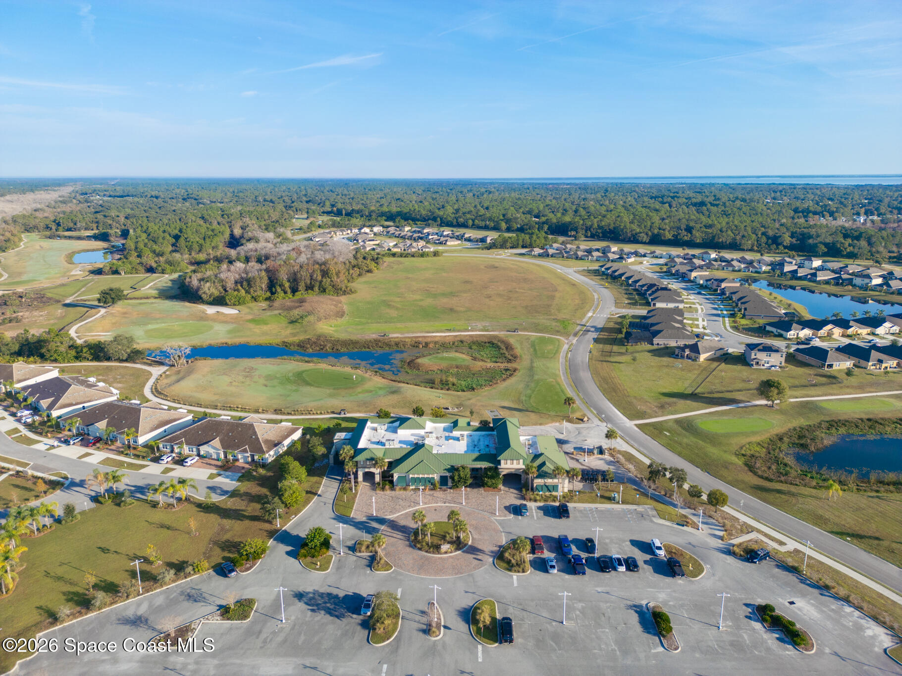 3210 Quantum Place Mims, FL 32754 - Photo 11 of 13 an aerial view of residential building and ocean