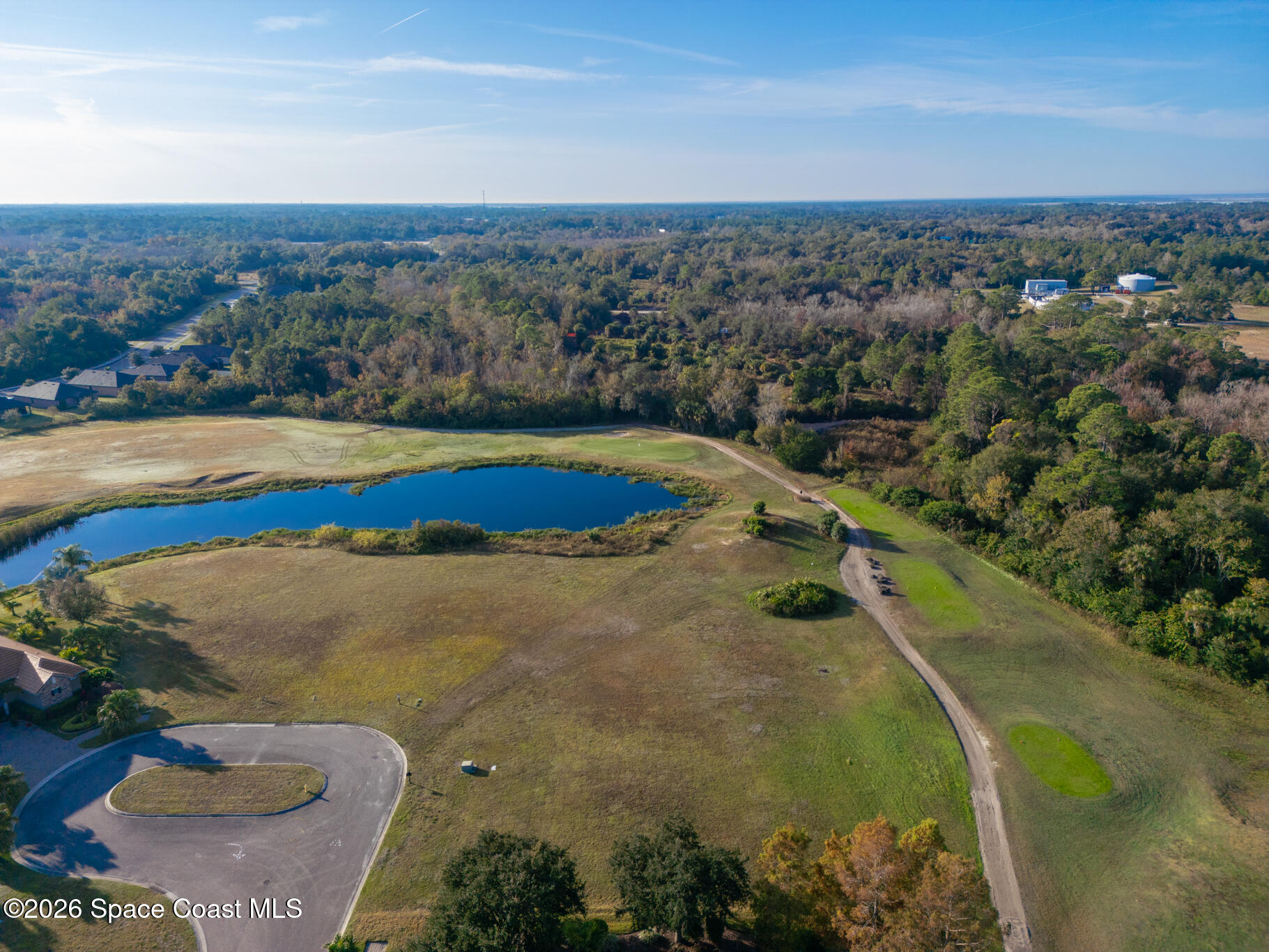 3210 Quantum Place Mims, FL 32754 - Photo 9 of 13 an aerial view of residential houses with outdoor space