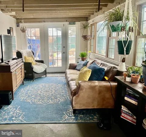 a living room with furniture and a rug