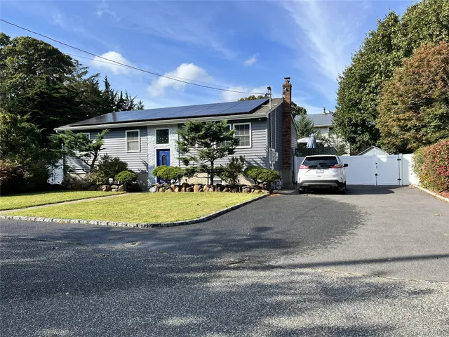 a view of a house with basketball court