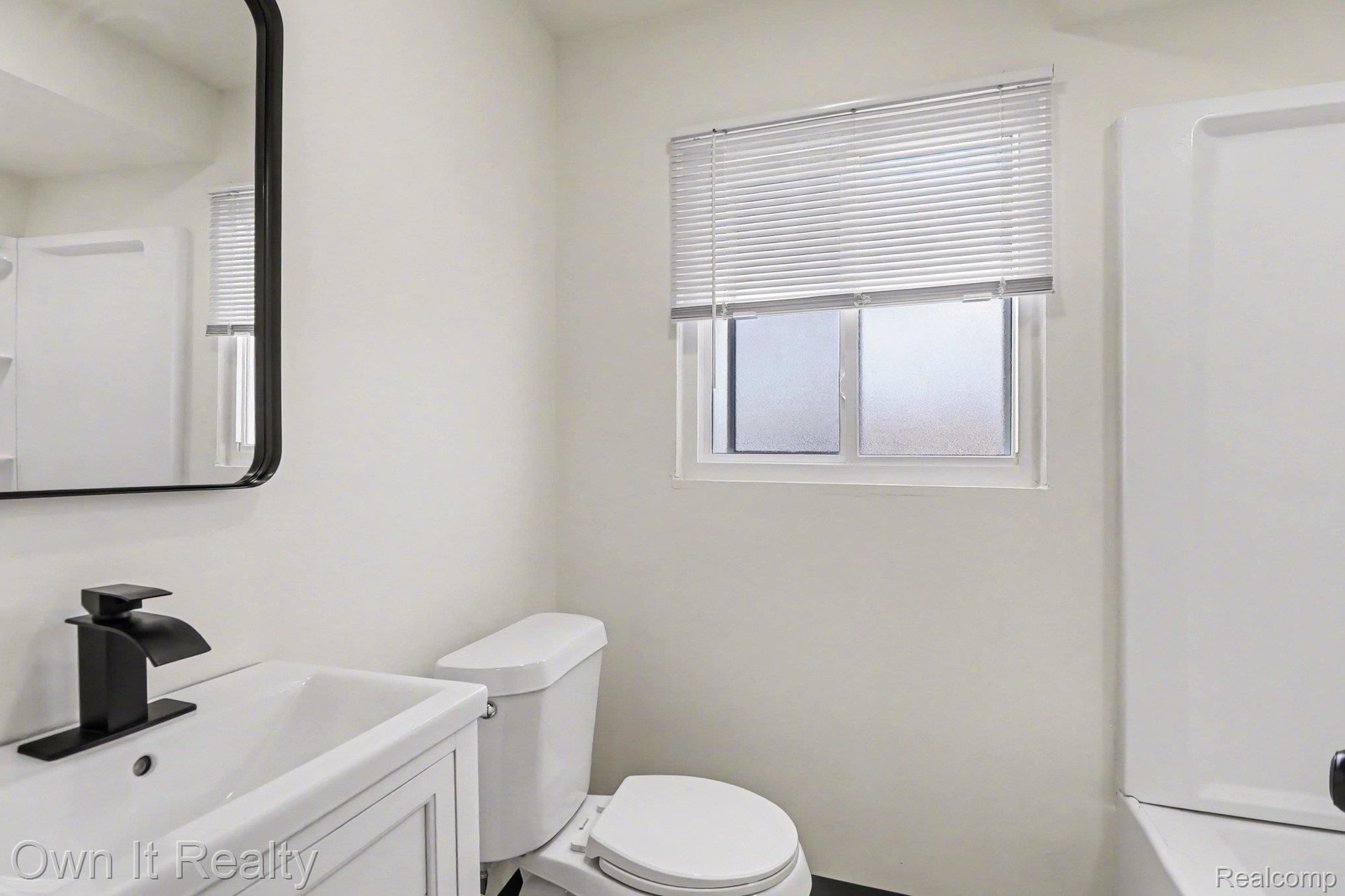 3 Joy Road, Unit 3 Detroit, MI 48228 - Photo 21 of 37 Bathroom featuring toilet and vanity